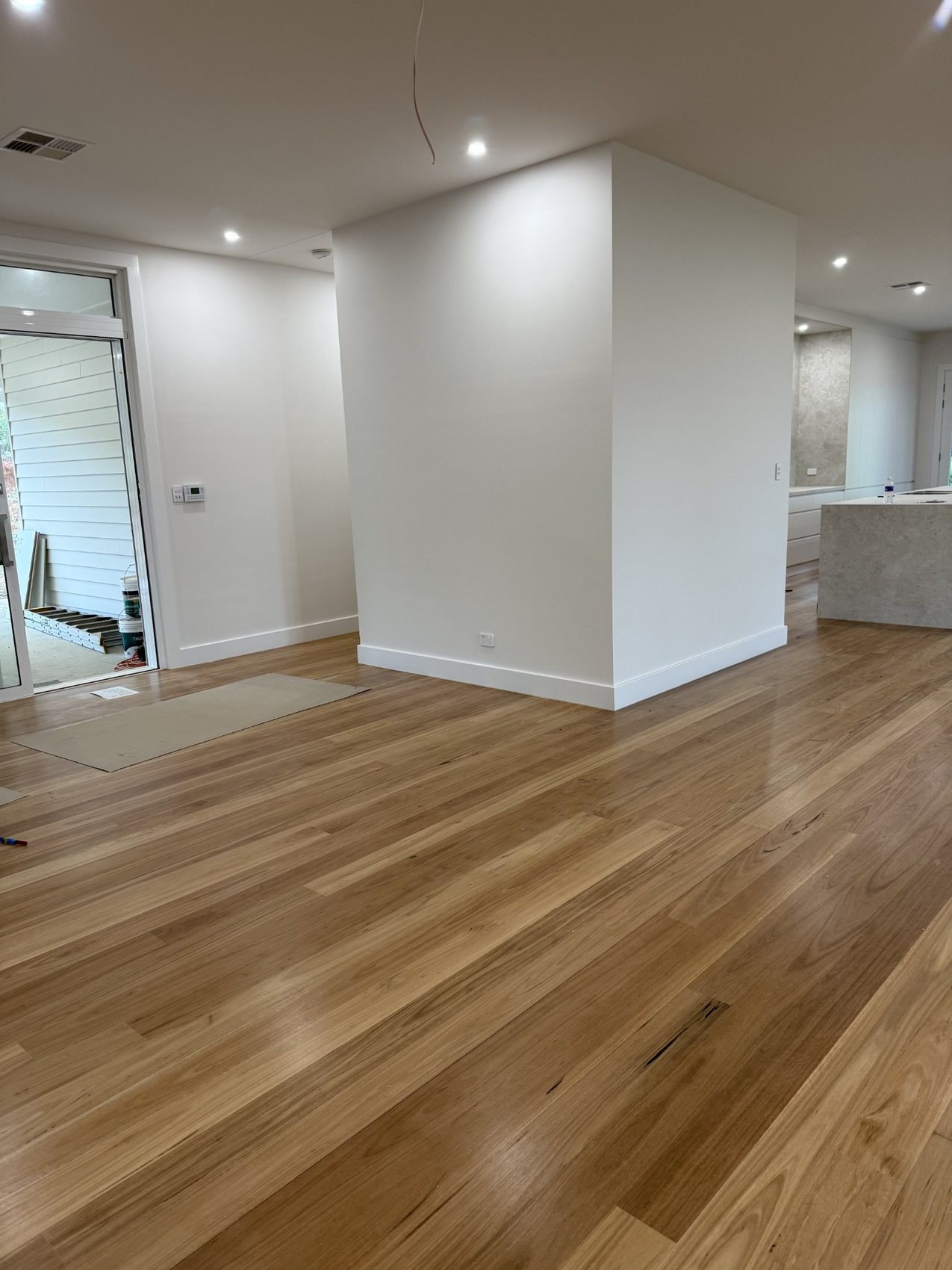 Modern interior with timber flooring, white walls and skirting boards